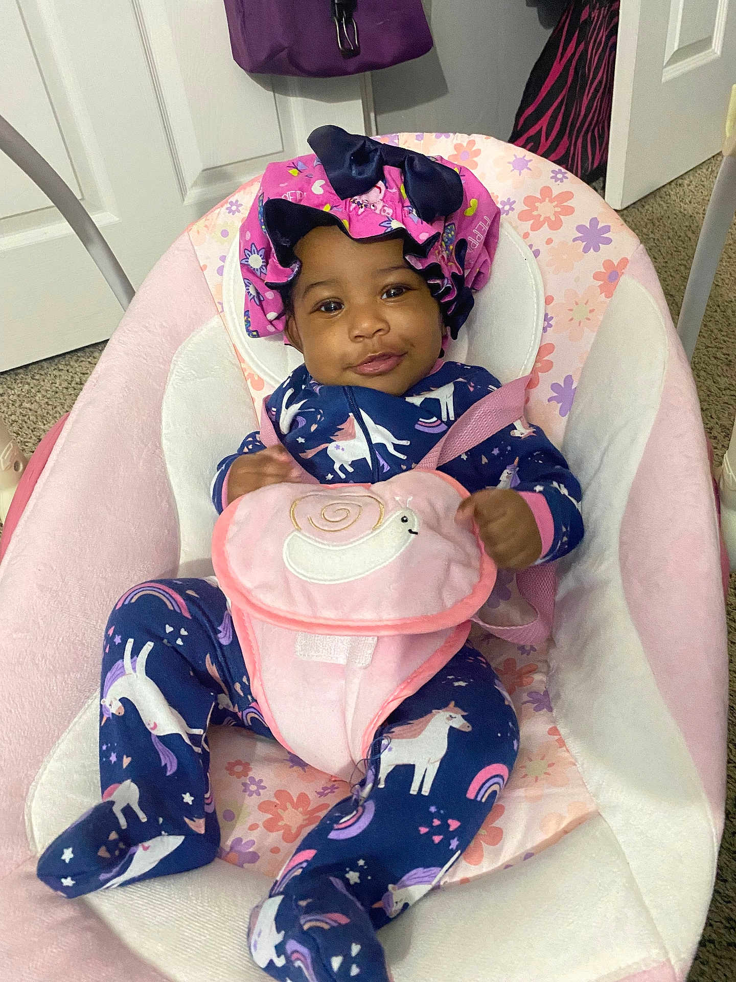 Ary joined the competition — help win amazing prizes! baby, infant, onesie, unicorn, pink, blue, baby_seat, smile, bonnet, pouch, snail, carpet, door, indoor, child, cute, happy, clothing, person, portrait