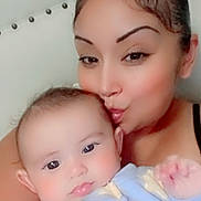 Athena joined the competition — help win amazing prizes! baby, infant, mother, adult, child, portrait, selfie, face, smile, kiss, affection, family, indoors, seated, blue_outfit, stars, clothing, close_up, people, happy