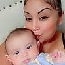 baby, infant, mother, adult, child, portrait, selfie, face, smile, kiss, affection, family, indoors, seated, blue_outfit, stars, clothing, close_up, people, happy