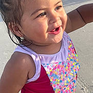 Ana joined the competition — help win amazing prizes! toddler, child, smiling, swimsuit, sequins, beach, sand, sunlight, wet_hair, happy, portrait, outdoor, cute, face, skin, arms, summer, vacation, playful, joyful