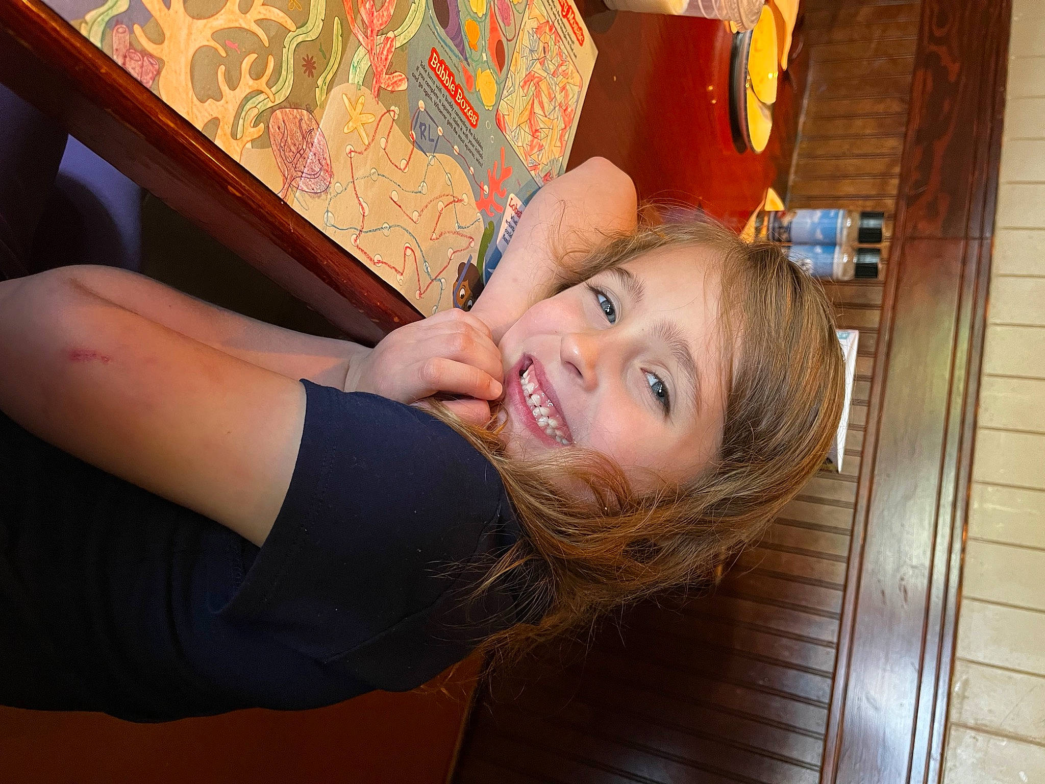 Deborah is registered to the contest to win money with this photo: arm, blond, brown_hair, elbow, eyelash, finger, flash_photography, floor, flooring, fun, happy, hardwood, human_leg, joy, leisure, long_hair, person, shoulder, smile, tree