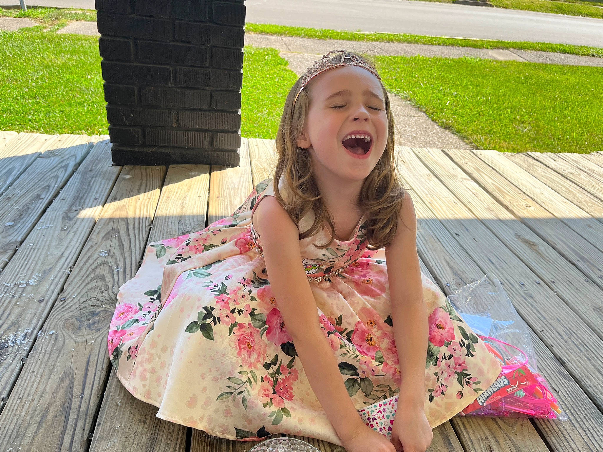 Deborah is registered to the contest to win money with this photo: dress, eyewear, face, fun, grass, hair, happy, head, lawn, leaf, leisure, people_in_nature, person, pink, plant, recreation, skin, smile, thigh, toddler