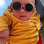 Anna participe au concours pour gagner de l'argent avec cette photo : baby, infant, sunglasses, yellow_outfit, limited_edition, person, portrait, indoor, child, cute, fashion, cozy, hand, furniture, tile_floor, cool, wearing, glasses, young, casual