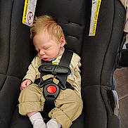 Alex joined the competition — help win amazing prizes! baby, sleeping, car_seat, infant, straps, clothing, white_socks, beige_pants, cream_sweater, hair, face, peaceful, child, black_car_seat, safety, seatbelt, newborn, cute, indoors, resting