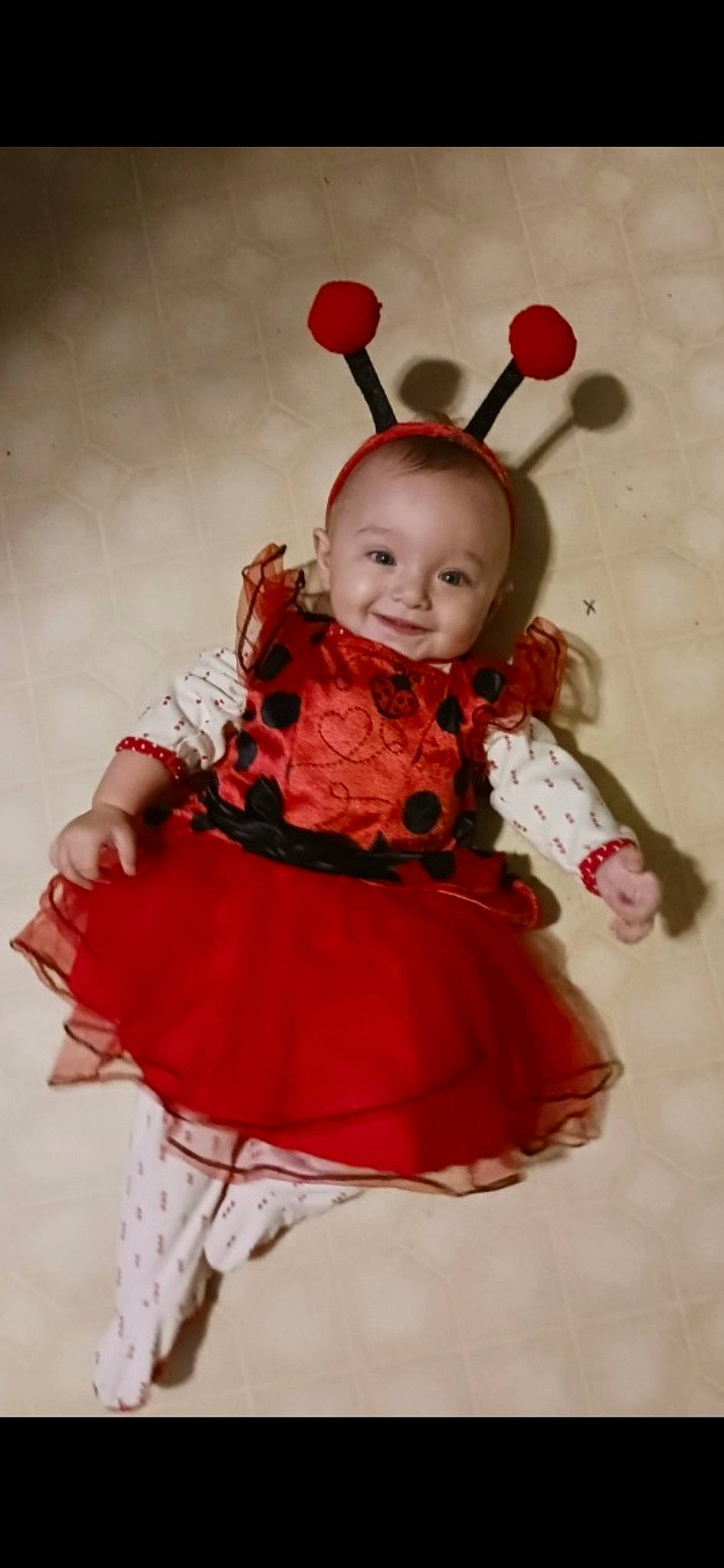 Ariah joined the competition — help win amazing prizes! baby, baby_products, baby_toddler_clothing, child, costume_hat, dress, event, fashion_accessory, hair_accessory, happy, headband, headgear, headpiece, joy, magenta, peach, person, pink, ruffle, sleeve