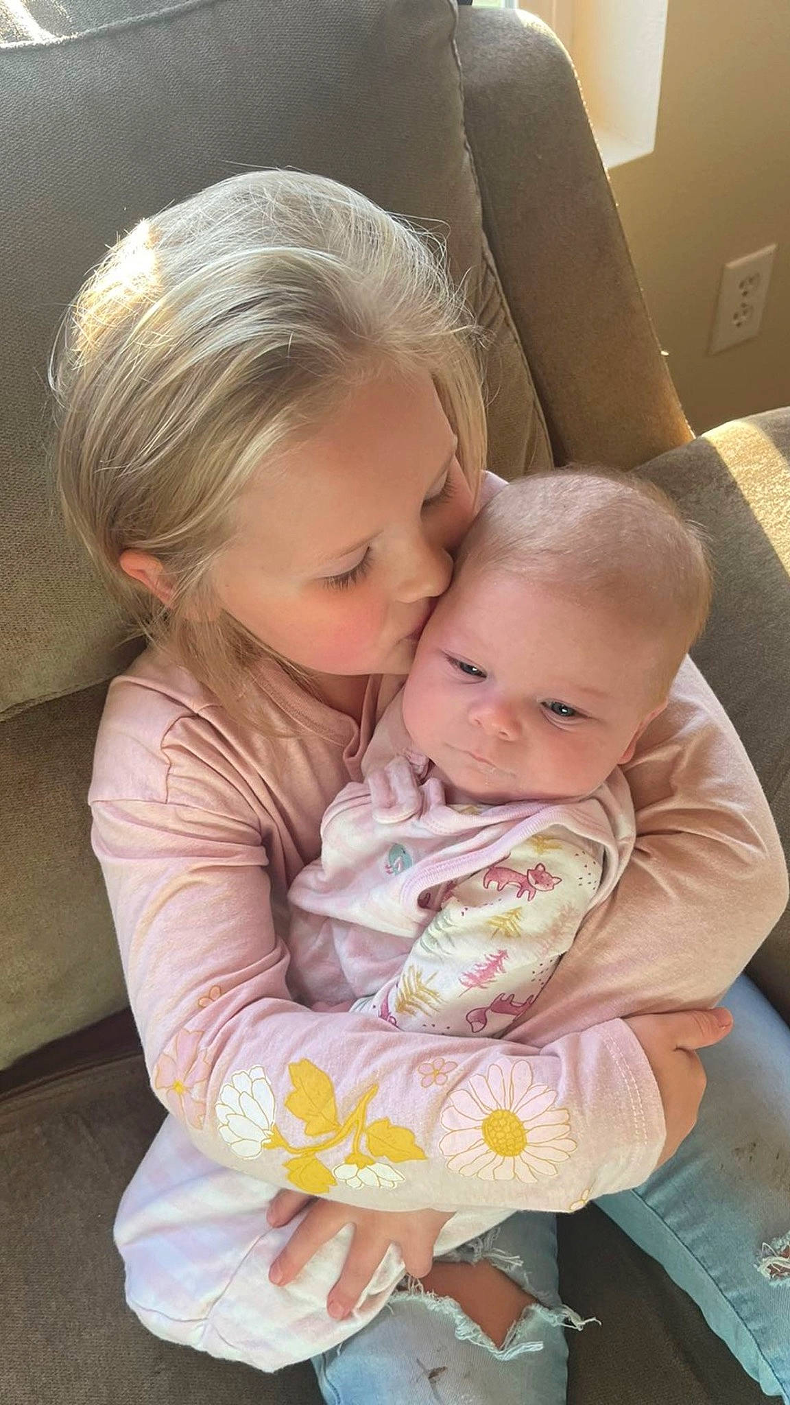 Melanie Carpenter is registered to the contest to win money with this photo: baby, baby_products, baby_toddler_clothing, bib, chair, cheek, child, comfort, couch, fun, gesture, hair, happy, lap, person, sitting, skin, smile, t_shirt, toddler