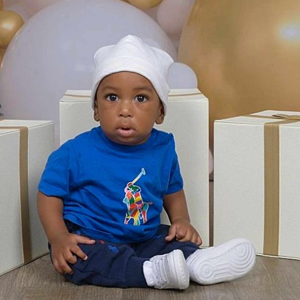 Quashay joined the competition — help win amazing prizes! baseballcap, box, boy, cap, child, clothing, couch, face, hat, head, male, pants, people, person, photography, portrait, sailorsuit, sitting, sleeve, t_shirt
