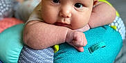 Marcella joined the competition — help win amazing prizes! baby, infant, face, pillow, colorful, patterned, skin, hand, eyes, resting, soft, indoor, bed, blanket, cute, closeup, portrait, child, person, cozy