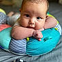 baby, infant, face, pillow, colorful, patterned, skin, hand, eyes, resting, soft, indoor, bed, blanket, cute, closeup, portrait, child, person, cozy
