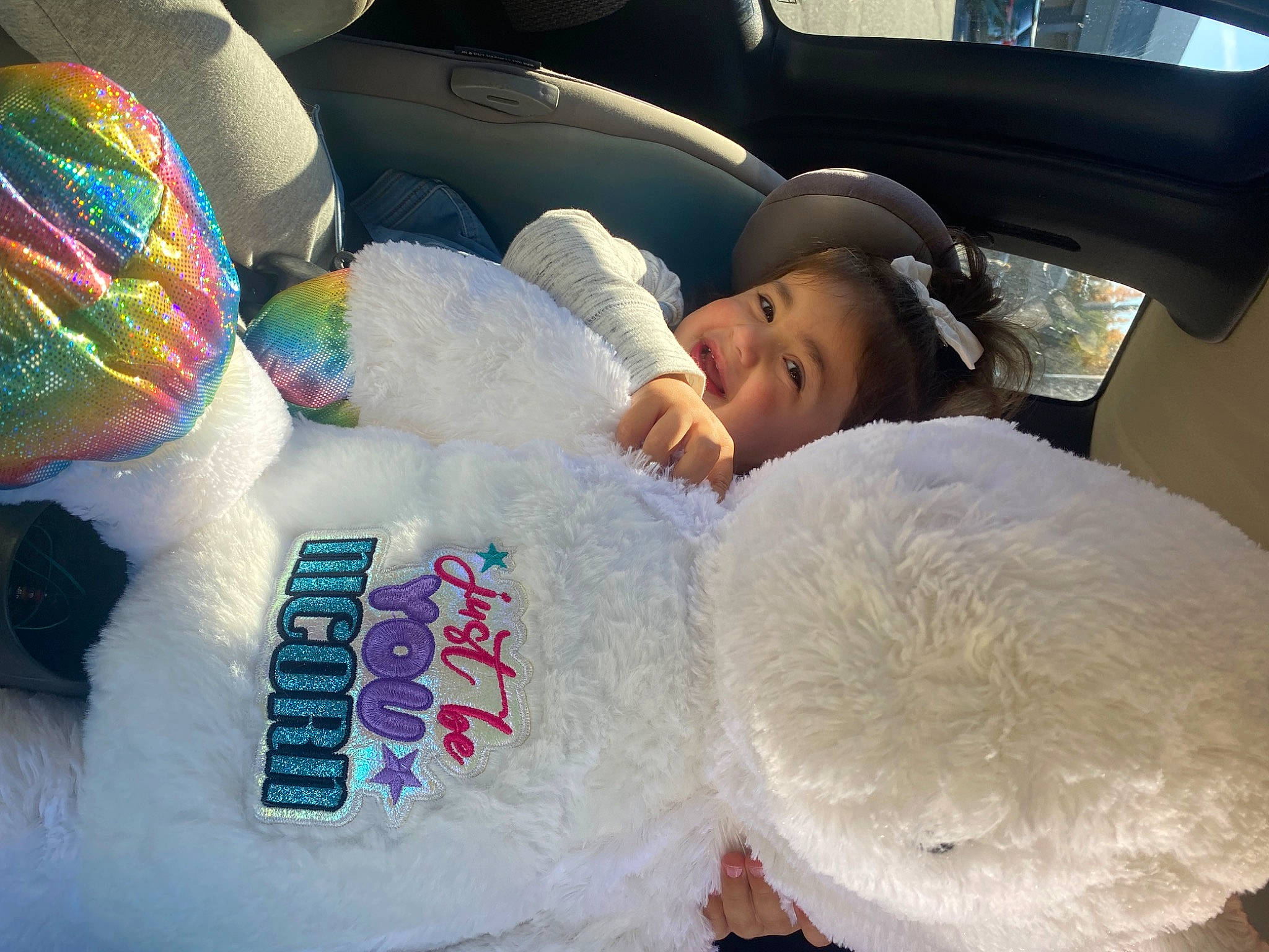Lainey is registered to the contest to win money with this photo: auto_part, automotive_design, beauty, car_seat, car_seat_cover, child, comfort, event, family_car, fun, happy, human, linens, mammal, person, snapshot, steering_wheel, textile, toddler, vehicle_door