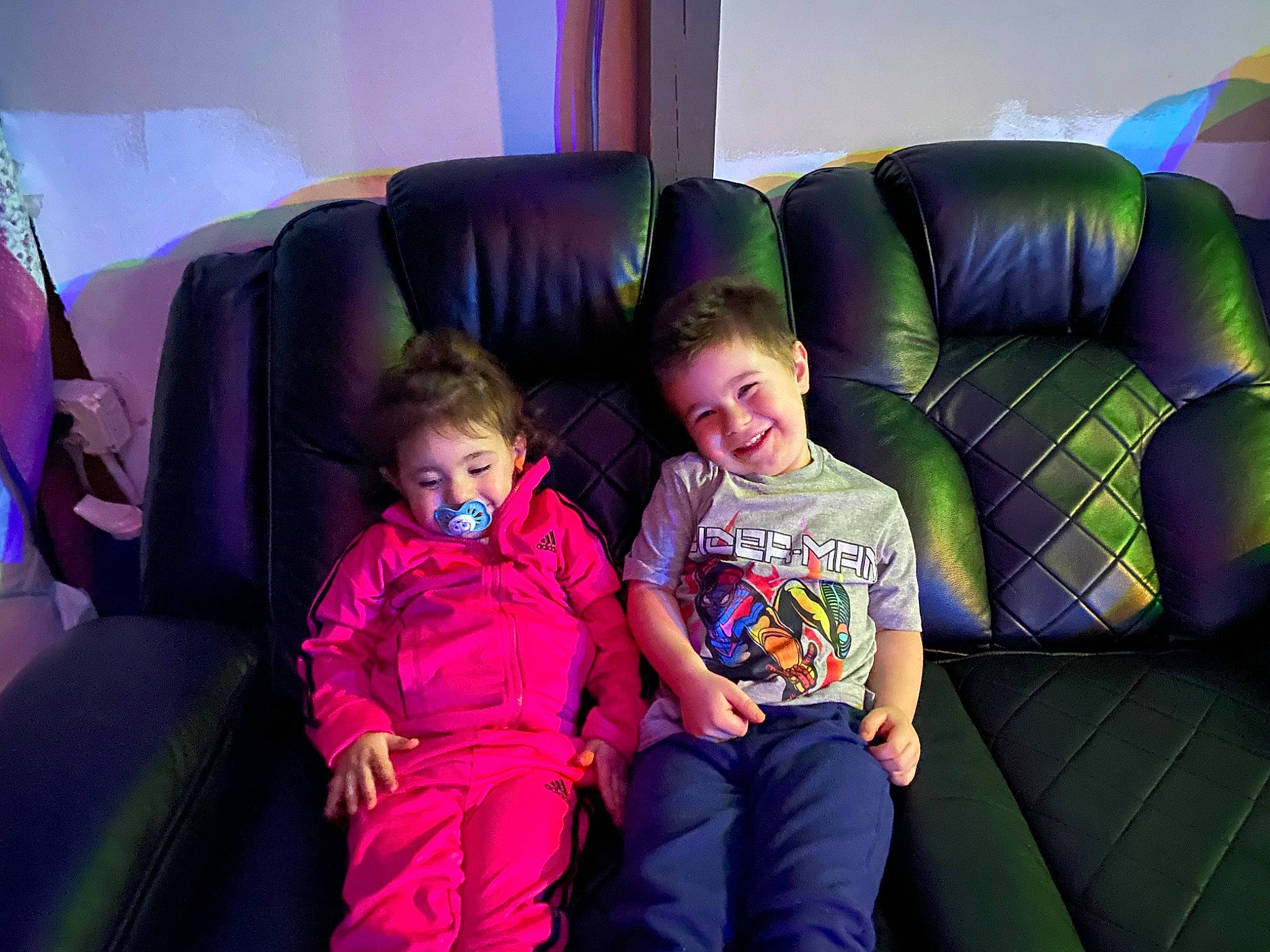Michael is registered to the contest to win money with this photo: child, comfort, couch, electric_blue, event, family_car, fun, joy, leisure, living_room, luxury_vehicle, magenta, person, purple, room, sitting, smile, t_shirt, throw_pillow, toddler