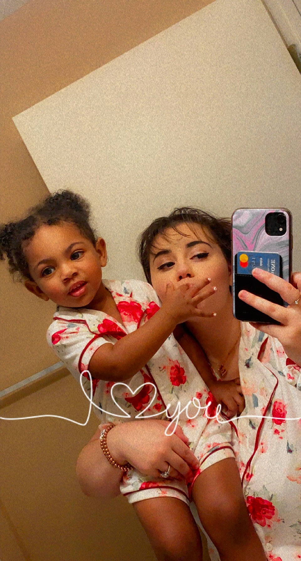 Amina is registered to the contest to win money with this photo: chest, child, communication_device, event, face, fun, gesture, hand, happy, leisure, mobile_phone, mouth, muscle, person, pink, portable_communications_device, skin, thigh, thumb, toddler