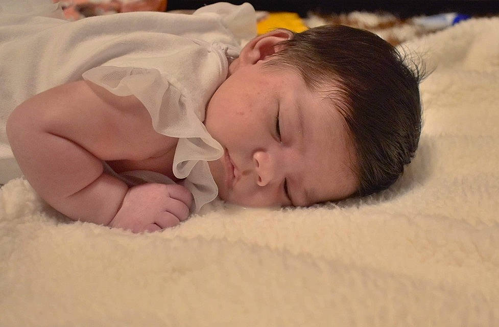 Ellie Joyce Mitchell joined the competition — help win amazing prizes! baby, baby_sleeping, baby_toddler_clothing, bed, bedding, bedtime, blanket, cheek, child, comfort, eyebrow, face, human, linens, mammal, nap, nose, person, skin, sleep