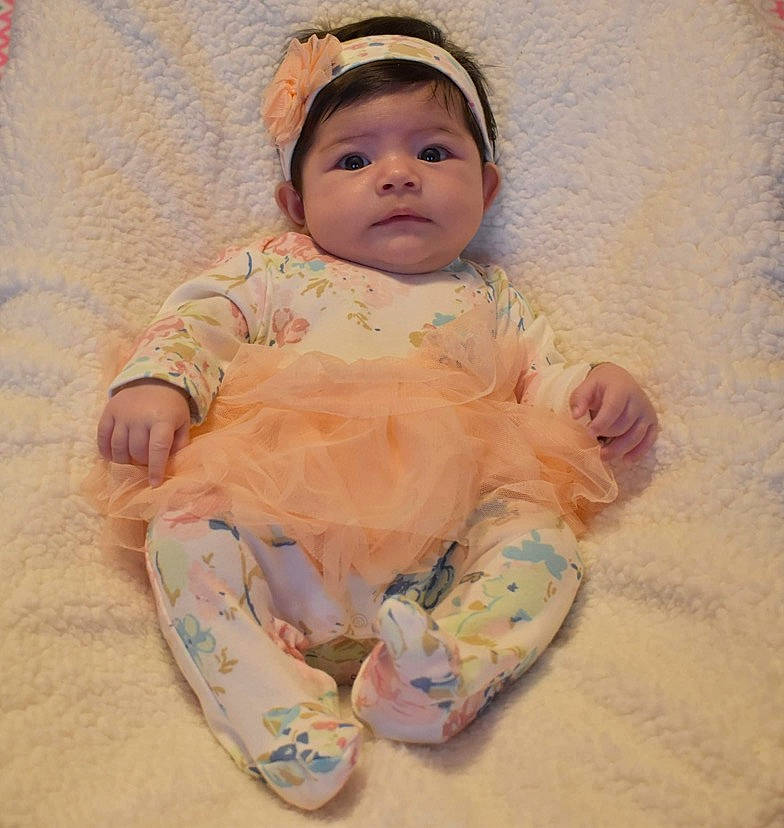 Ellie Joyce Mitchell joined the competition — help win amazing prizes! baby, baby_products, baby_toddler_clothing, bonnet, cheek, child, embellishment, hair_accessory, headband, headgear, headpiece, linens, nose, peach, person, skin, sock, toddler