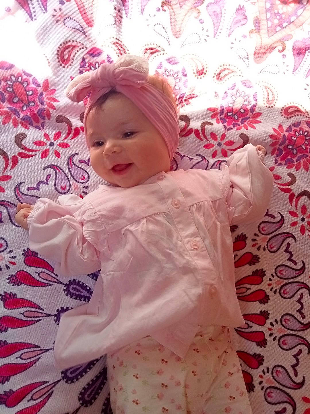 Cadence participe au concours pour gagner de l'argent avec cette photo : baby, baby_toddler_clothing, child, costume, facial_expression, fun, happy, headgear, headwear, linens, magenta, pattern, peach, person, petal, pink, purple, room, skin, sleeve