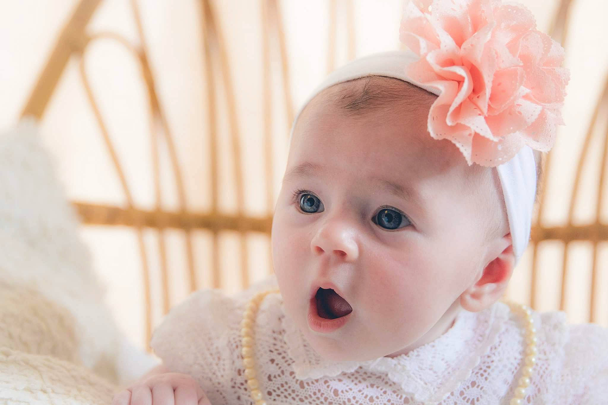 Rosie participe au concours pour gagner de l'argent avec cette photo : baby, beauty, cheek, child, eye, face, facial_expression, hair_accessory, head, headband, headgear, headpiece, lip, nose, person, photograph, pink, skin, smile, surprise
