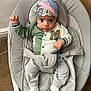 Leon joined the competition — help win amazing prizes! baby, infant, bandana, green_clothing, white_socks, baby_seat, carpet, indoor, fist_raised, cute, portrait, child, face, sitting, cozy, young_child, expression, headwear, casual_clothing, comfortable
