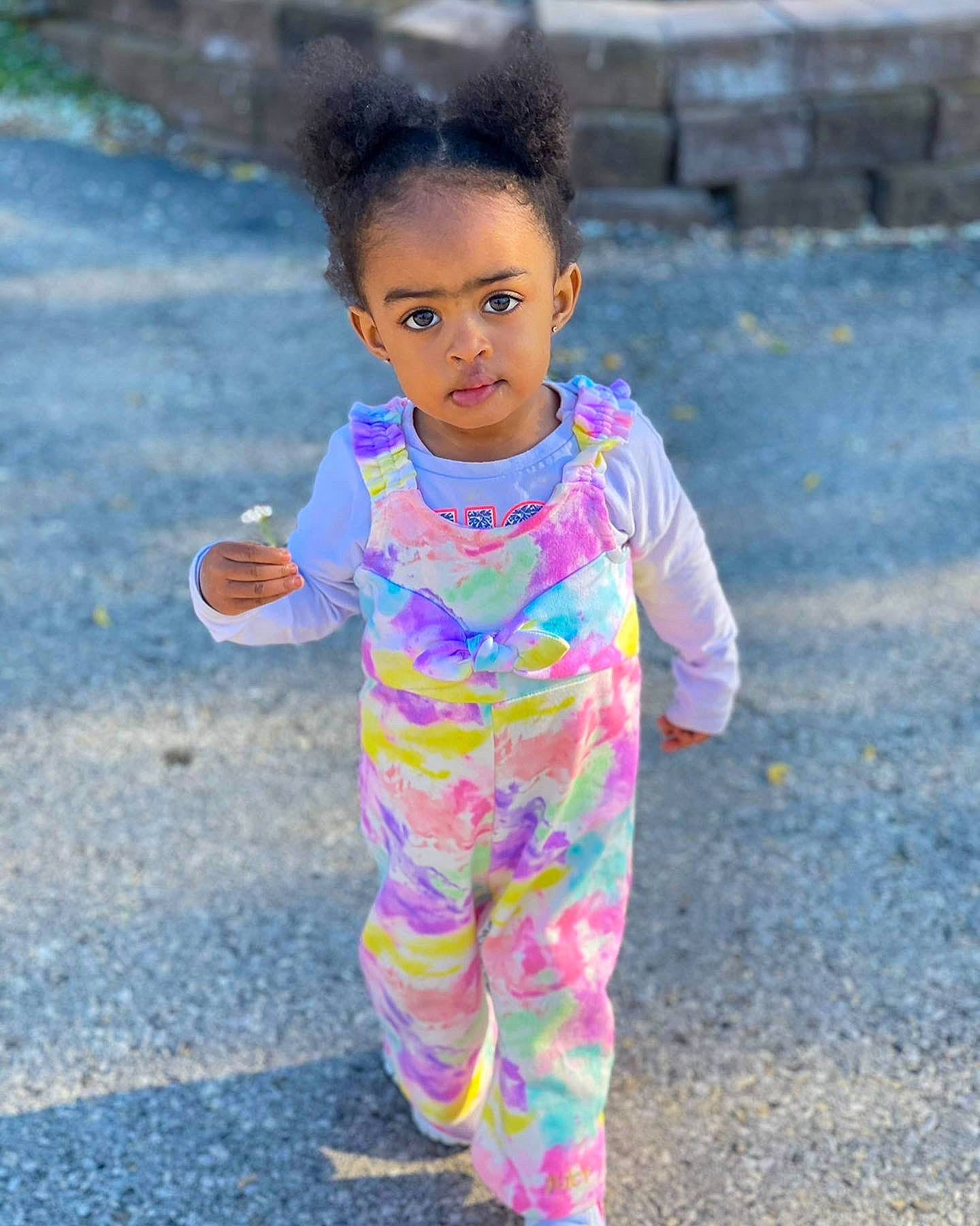 Madeleine is registered to the contest to win money with this photo: asphalt, baby_toddler_clothing, child, fun, grass, hairstyle, happy, leisure, magenta, people_in_nature, person, pink, play, purple, recreation, sleeve, smile, sneakers, street_fashion, t_shirt