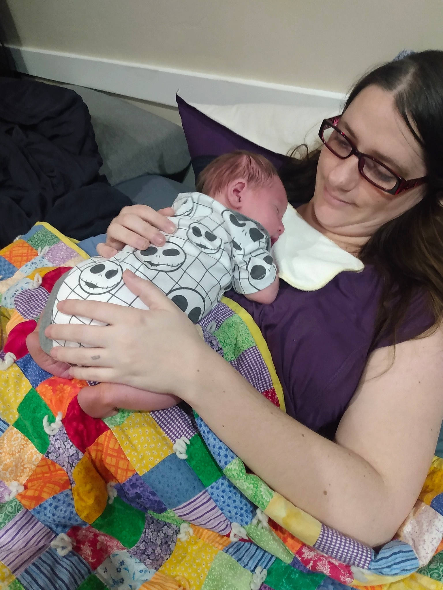 Ivar is registered to the contest to win money with this photo: art, baby, child, comfort, couch, eyewear, finger, fun, glasses, happy, joy, leisure, linens, nail, pattern, person, recreation, room, sitting, t_shirt