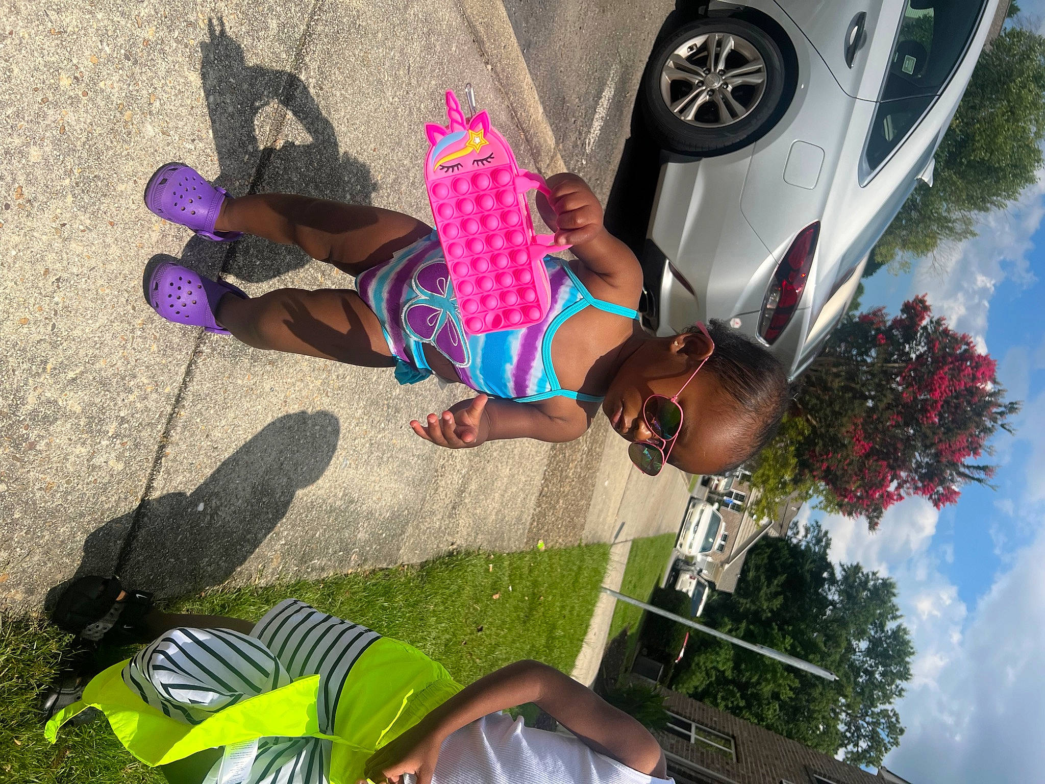 Jaliyah joined the competition — help win amazing prizes! automotive_lighting, automotive_tire, car, cloud, eyewear, fun, hat, leg, leisure, light, person, photograph, recreation, sky, snapshot, sunglasses, thigh, tire, tree, wheel