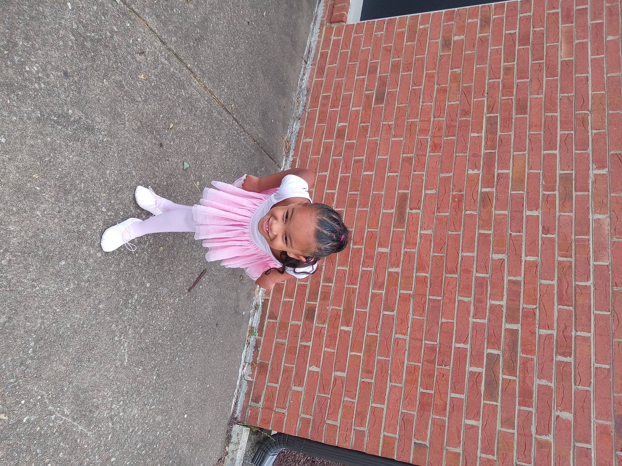 Arie joined the competition — help win amazing prizes! asphalt, brick, brickwork, child, cobblestone, concrete, flooring, joy, leisure, magenta, pattern, pedestrian, person, pink, road_surface, shadow, sidewalk, street, sunglasses, toddler