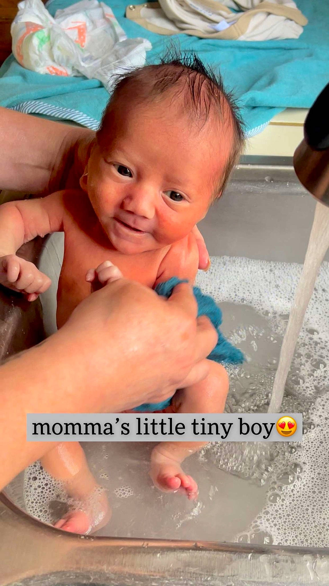 Dawson is registered to the contest to win money with this photo: baby, blue, cheek, child, finger, fun, gesture, hand, happy, human_leg, joint, leisure, mouth, nail, person, pink, product, skin, smile, thumb