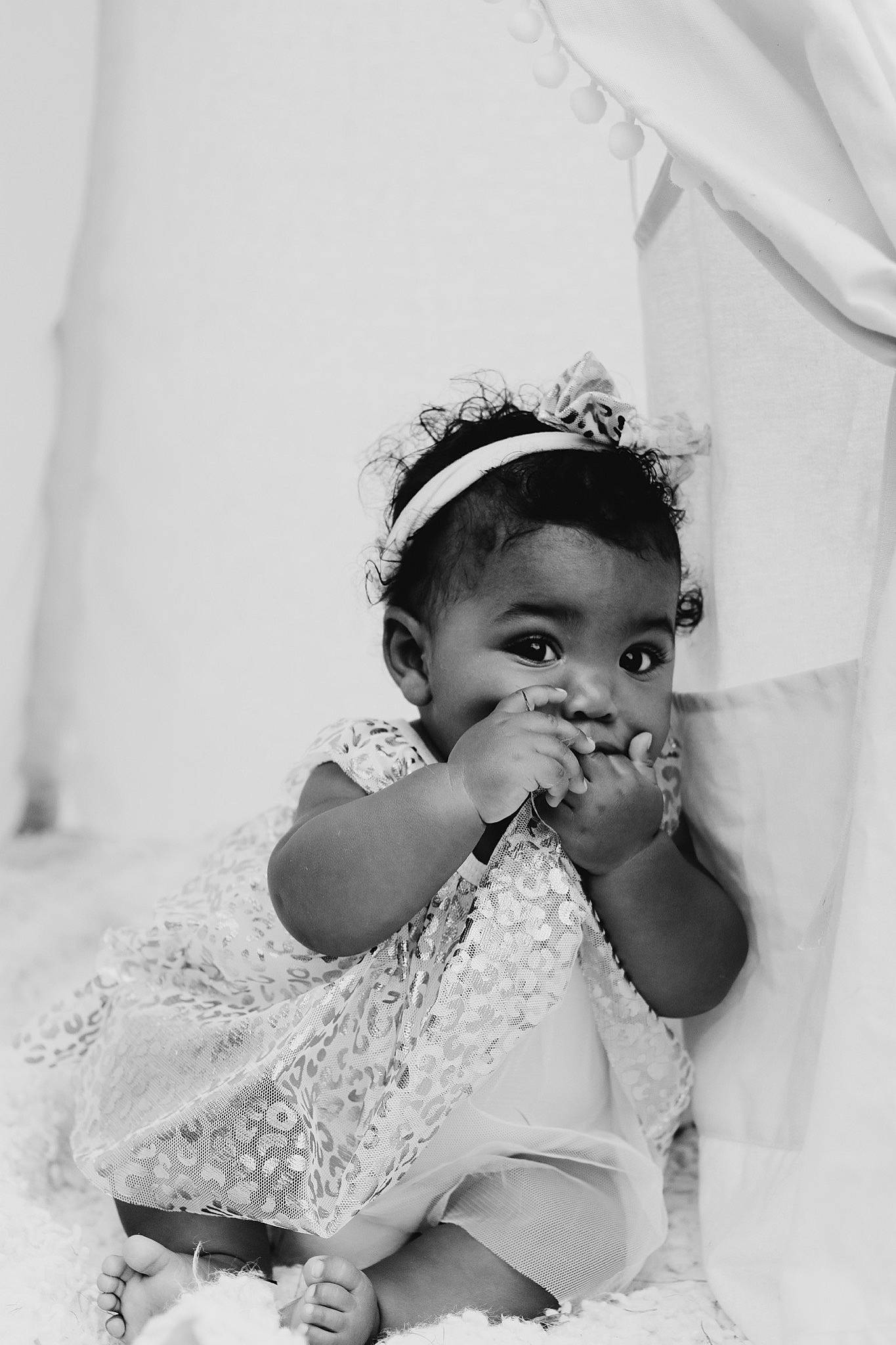 Bailee is registered to the contest to win money with this photo: baby, baby_toddler_clothing, black_and_white, dress, event, eye, fashion_accessory, fashion_design, flash_photography, gesture, happy, headpiece, human_body, monochrome, monochrome_photography, person, skin, style, textile, toddler