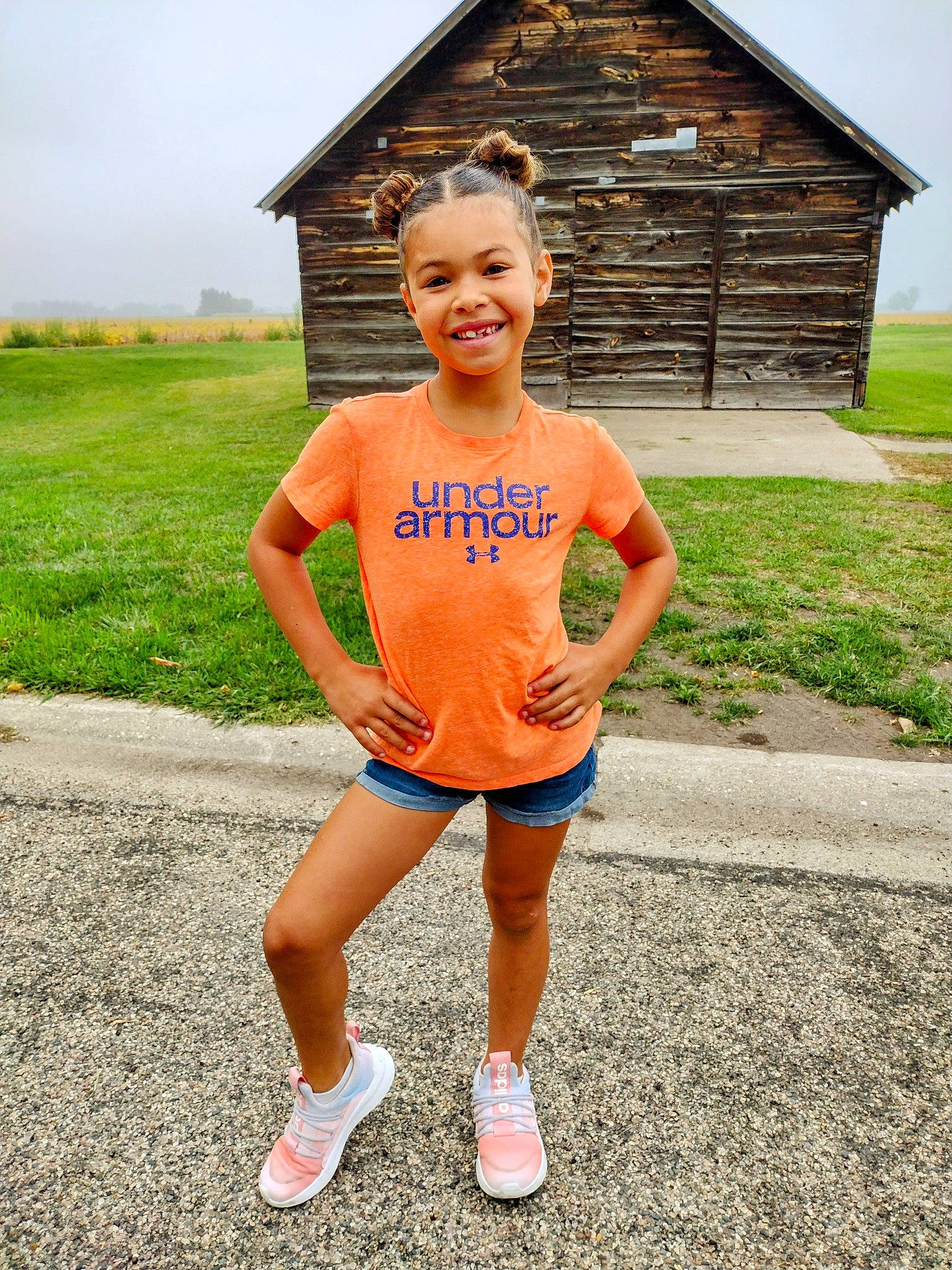 Paityn is registered to the contest to win money with this photo: electric_blue, face, fun, grass, grassland, happy, house, human_leg, joy, knee, landscape, leisure, people_in_nature, person, recreation, shorts, sky, smile, sportswear, t_shirt