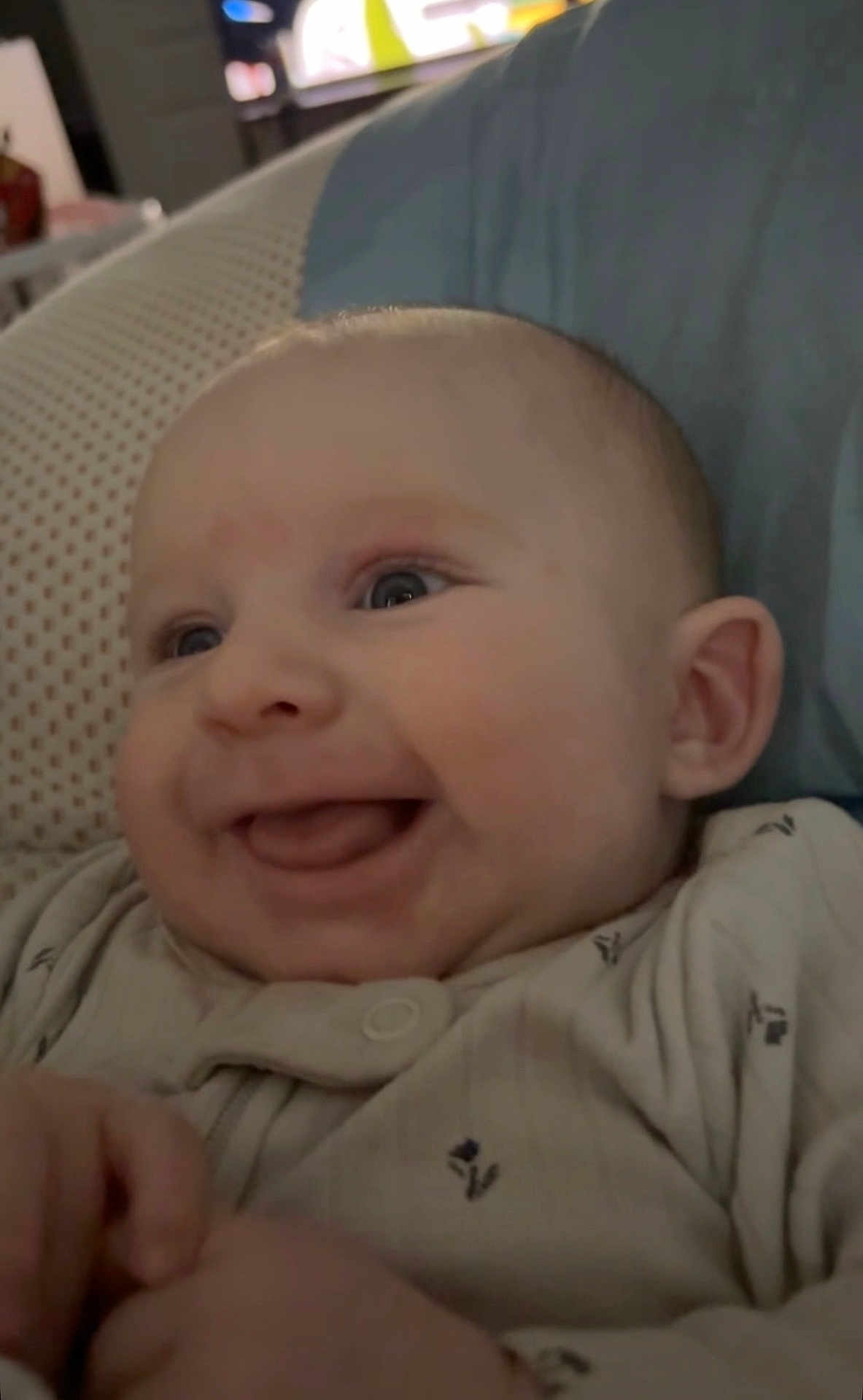 Phoenix Aziel joined the competition — help win amazing prizes! baby, smile, face, infant, clothing, hand, blue_pillow, cozy, happy, cute, skin, eyes, young_child, closeup, portrait, lying_down, soft_surface, expression, indoors, person
