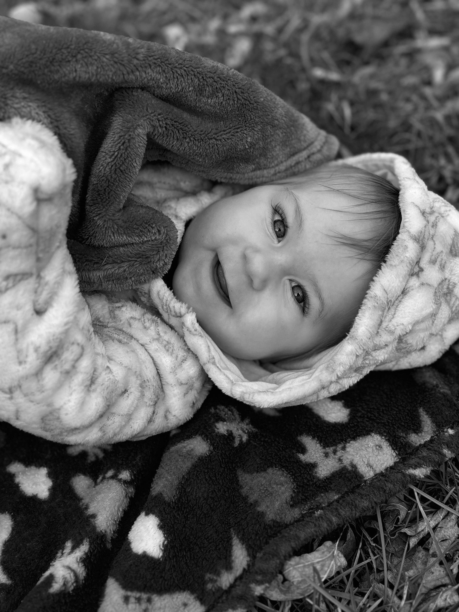 Huxley is registered to the contest to win money with this photo: black_and_white, cheek, eye, face, flash_photography, grass, grey, hair, happy, head, headwear, iris, joy, leaf, lip, mammal, nose, people_in_nature, person, plant