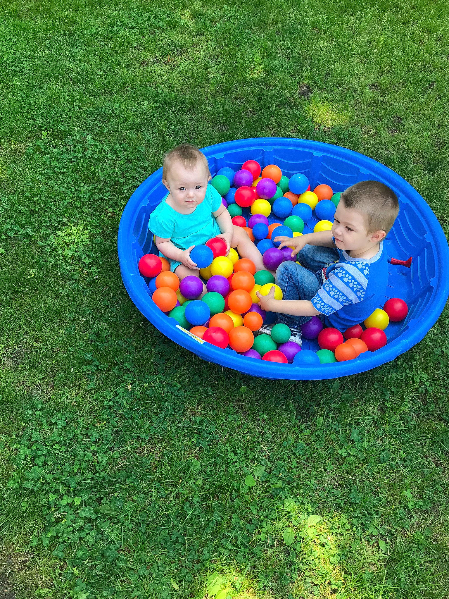 Donald is registered to the contest to win money with this photo: baby_toys, ball_pit, child, fun, grass, inflatable, leisure, person, play, product, toddler, toy
