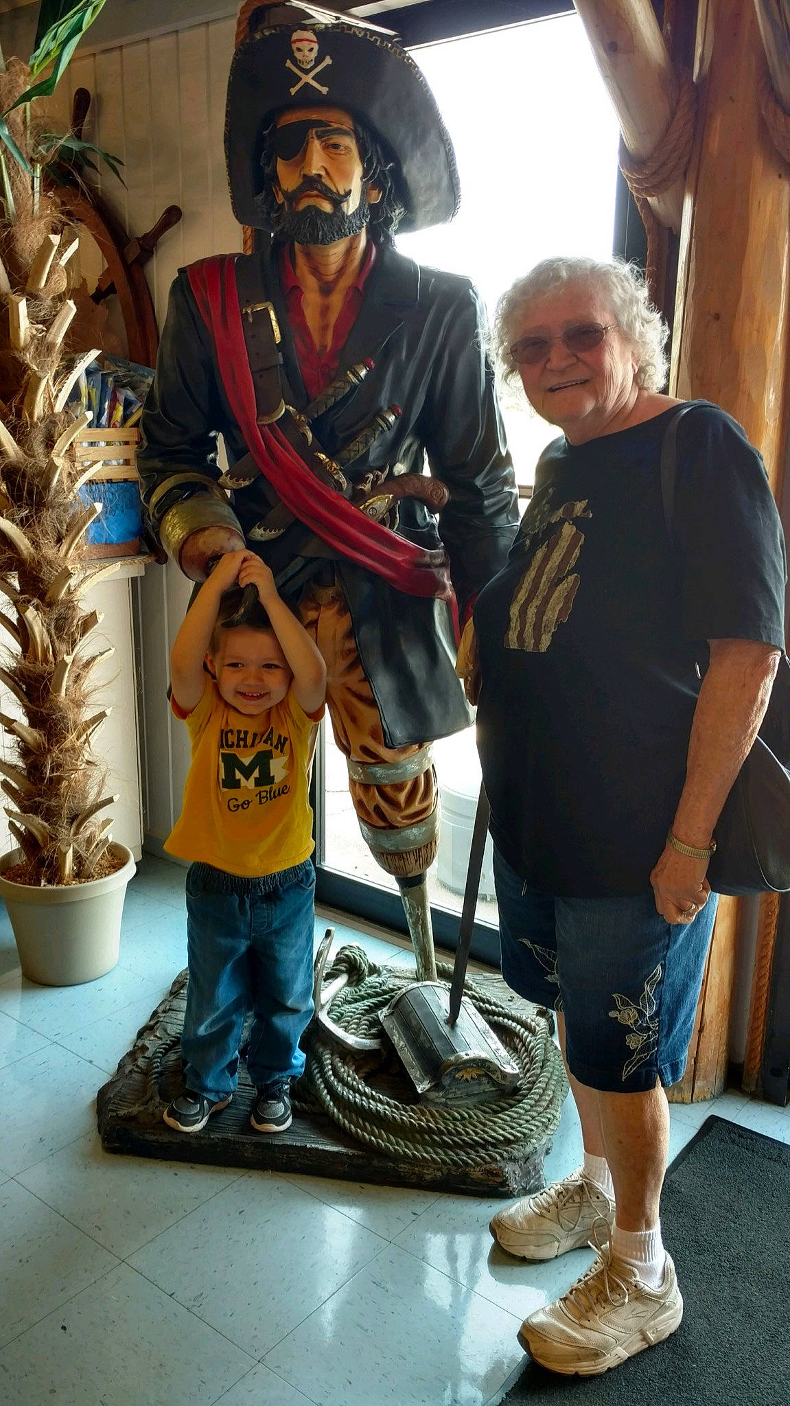 Donald is registered to the contest to win money with this photo: art, headwear, joy, person, sculpture, statue