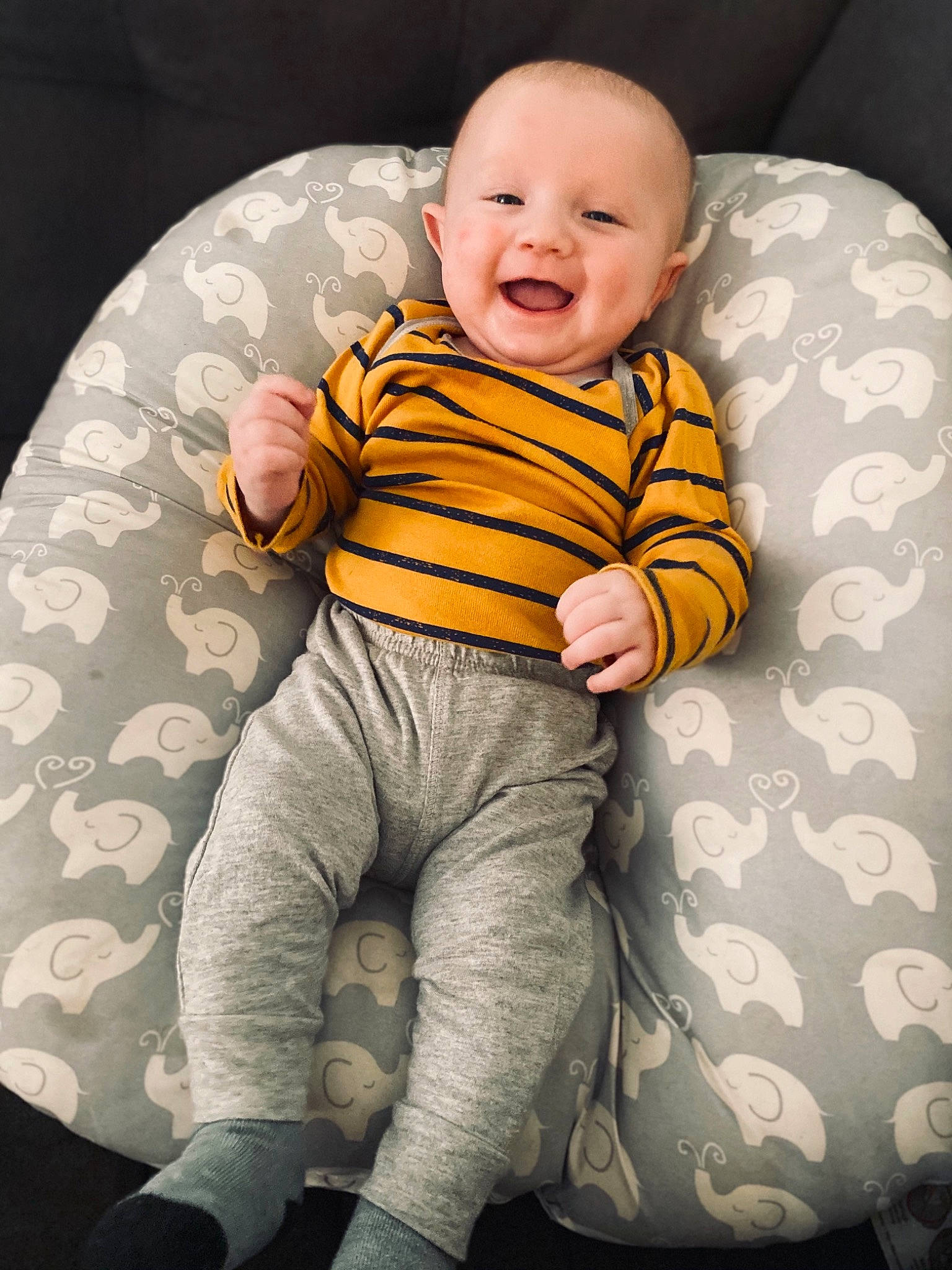 Hayden joined the competition — help win amazing prizes! baby, baby_products, baby_toddler_clothing, cheek, child, comfort, facial_expression, human, human_body, humour, lap, laugh, long_sleeved_t_shirt, nose, person, portrait_photography, sitting, sleeve, sock, toddler