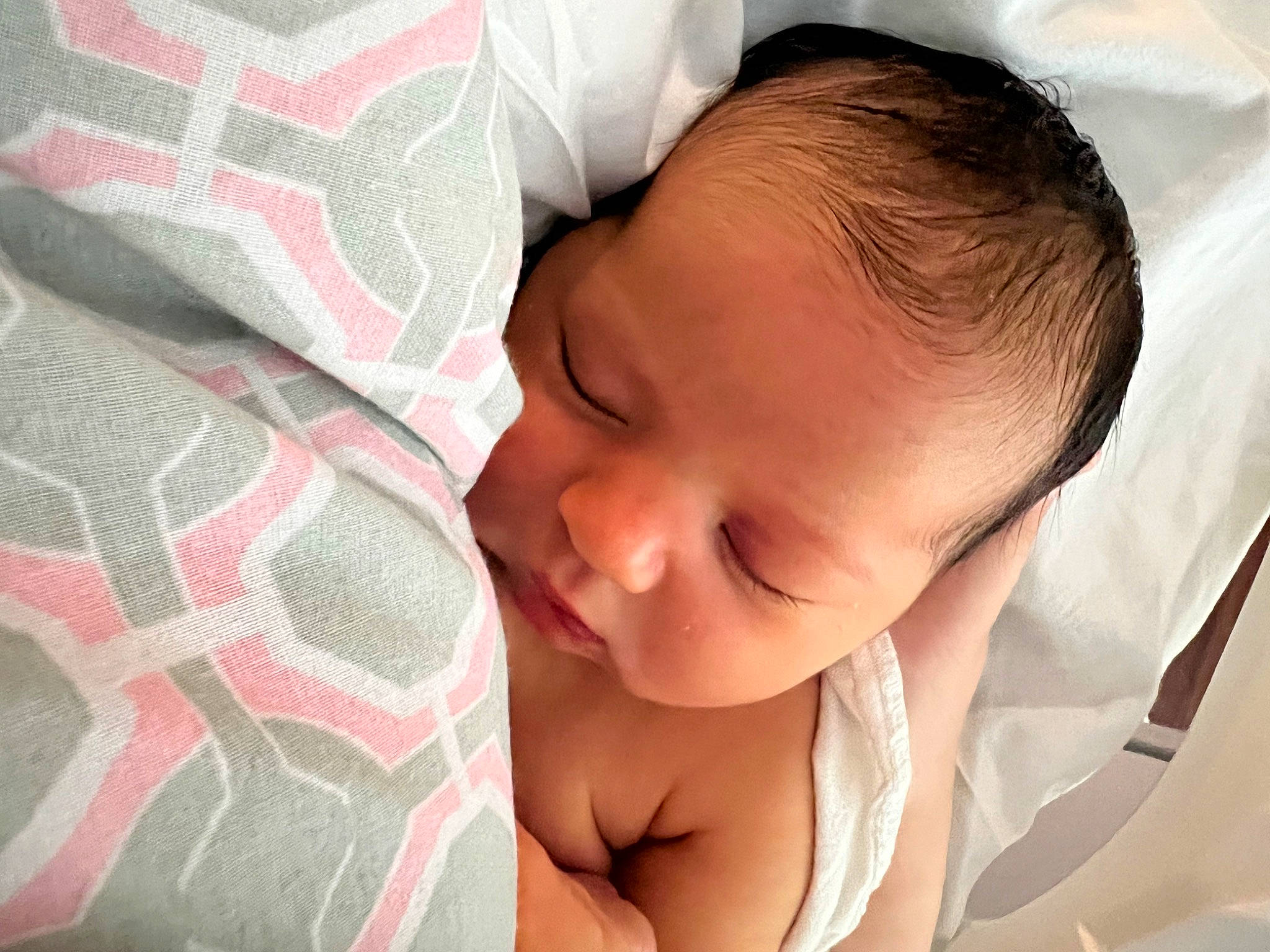 Everett is registered to the contest to win money with this photo: baby, baby_sleeping, baby_toddler_clothing, bedtime, cheek, child, comfort, eyelash, happy, linens, lip, nose, pattern, person, pink, portrait_photography, skin, smile, textile, thumb