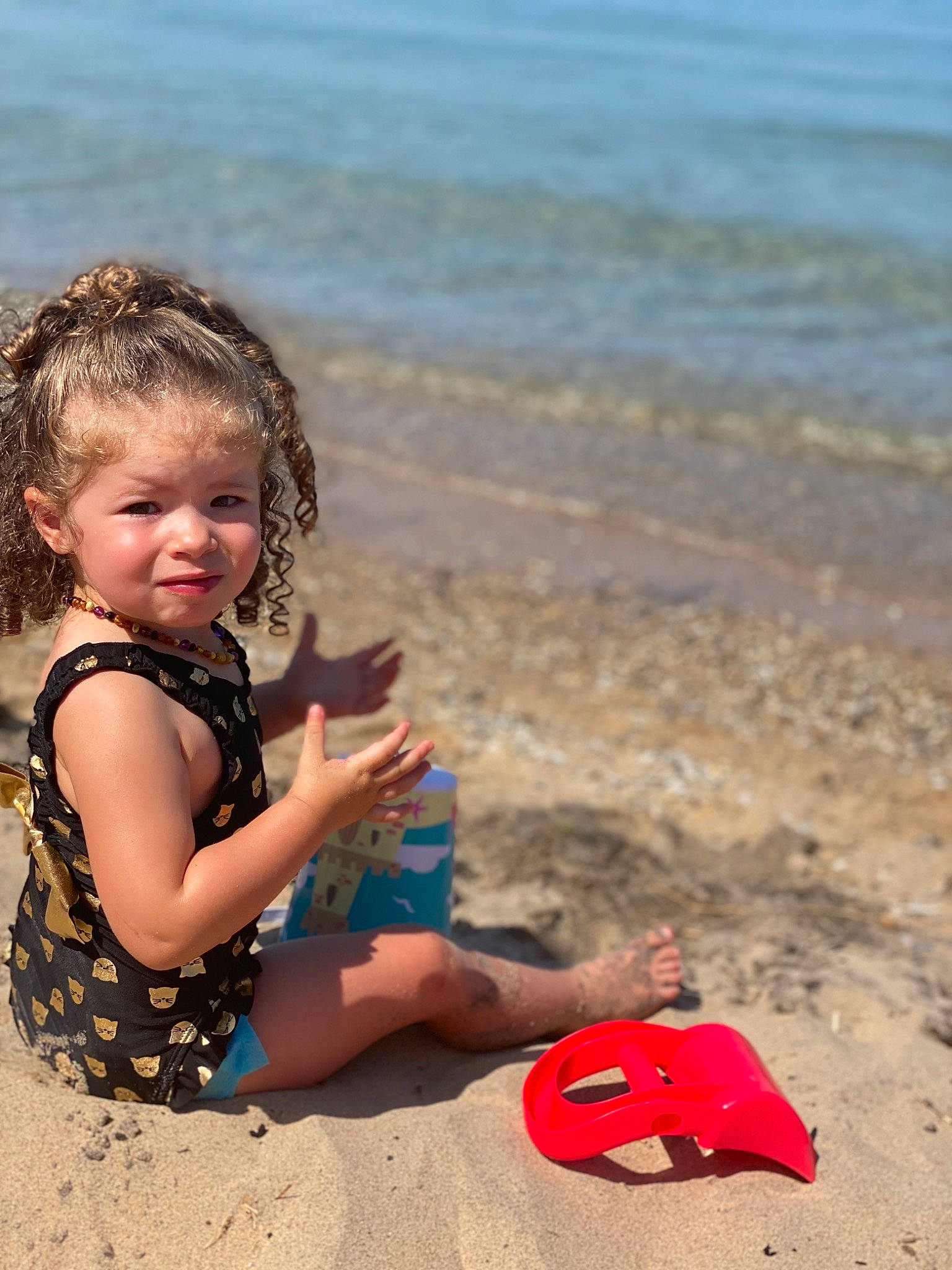 Addy joined the competition — help win amazing prizes! baby, beach, child, coast, fun, happy, holiday, ocean, person, play, sand, sea, sitting, smile, summer, toddler, vacation