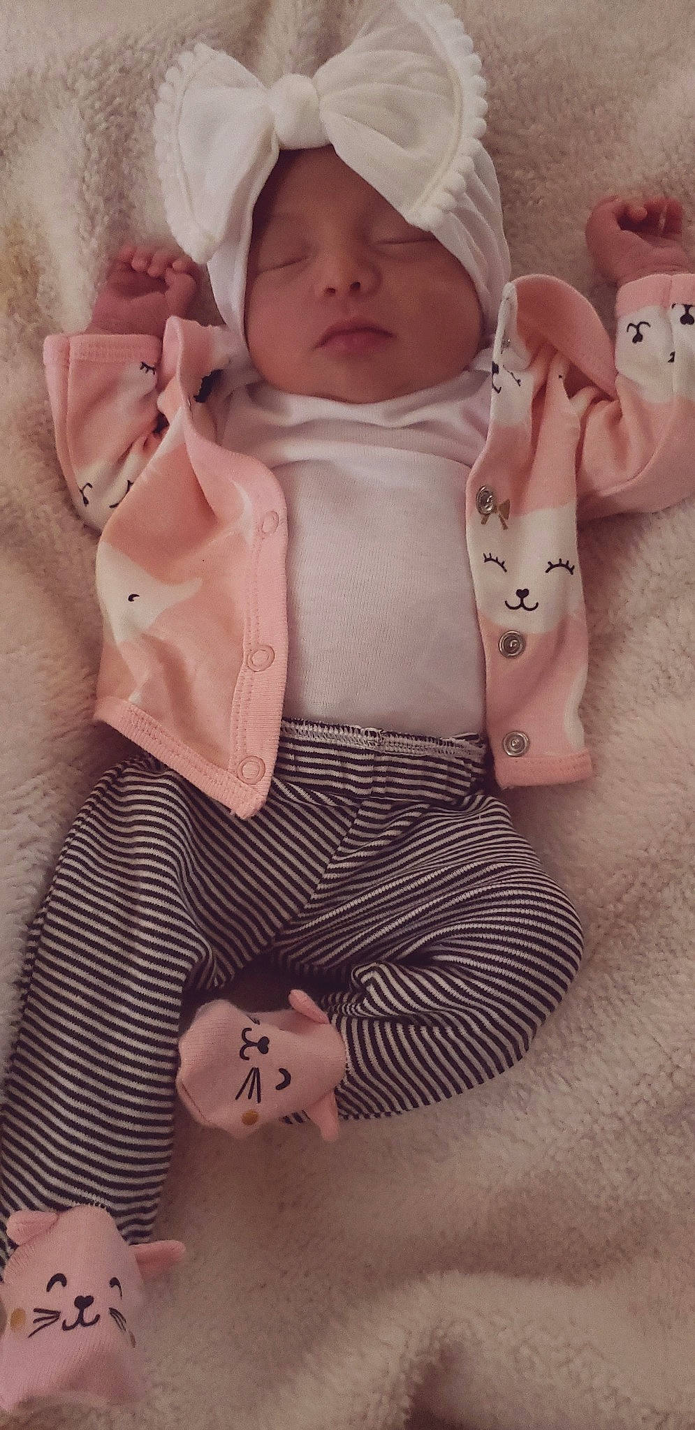 Alia is registered to the contest to win money with this photo: baby, cheek, child, ear, finger, hand, outerwear, peach, person, pink, product, skin, textile, toddler