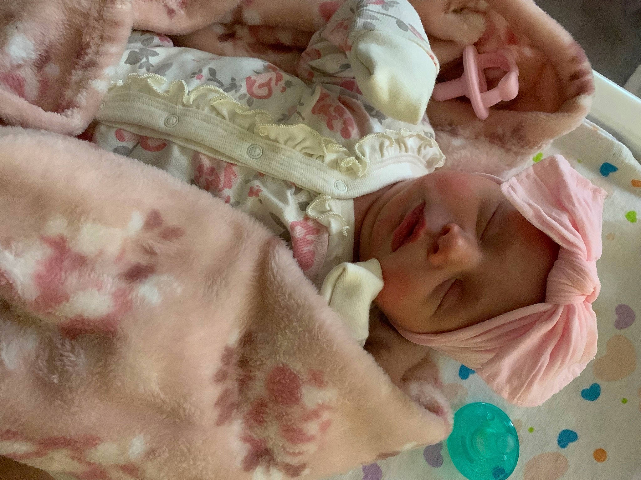 Kenslee joined the competition — help win amazing prizes! baby, baby_products, baby_toddler_clothing, bedding, bedtime, cheek, child, comfort, finger, happy, head, headwear, linens, mouth, pattern, peach, person, pink, skin, smile