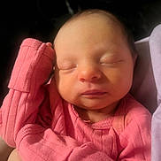 Stella is registered to the contest to win money with this photo: arm, baby, child, closed_eyes, cozy, cute, face, human, indoors, infant, newborn, newborn_baby, peaceful, pink_clothing, portrait, resting, skin, sleeping, small, soft_light