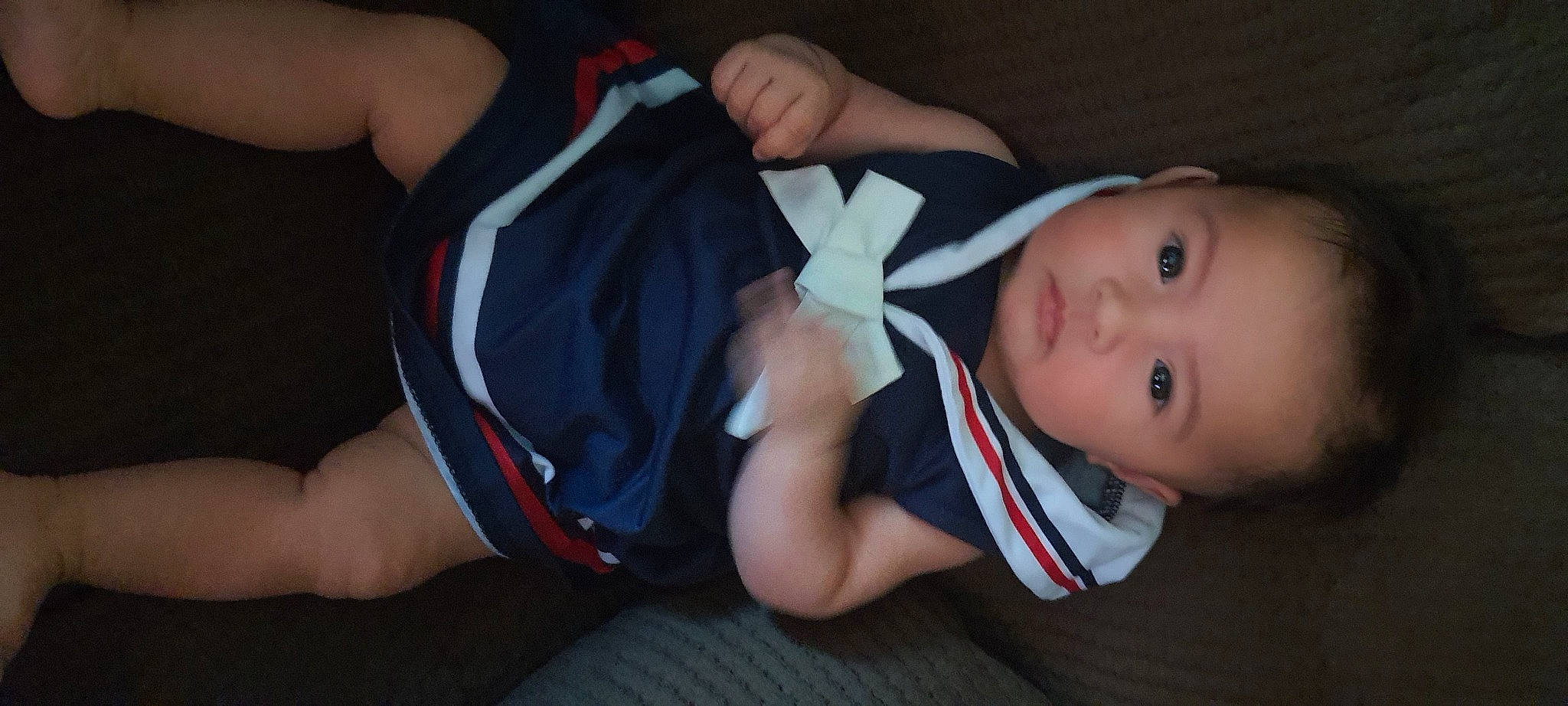 Kristine is registered to the contest to win money with this photo: abdomen, baby, baby_toddler_clothing, chest, child, comfort, elbow, fun, human_leg, joint, knee, lap, leg, person, shorts, sitting, sock, sports_uniform, thigh, toddler