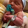 Elias is registered to the contest to win money with this photo: arm, baby, blanket, cap, closeup, cute, family, hand, hospital_bracelet, indoor, infant, love, newborn, pacifier, person, resting, skin, sleeping, soft, tender