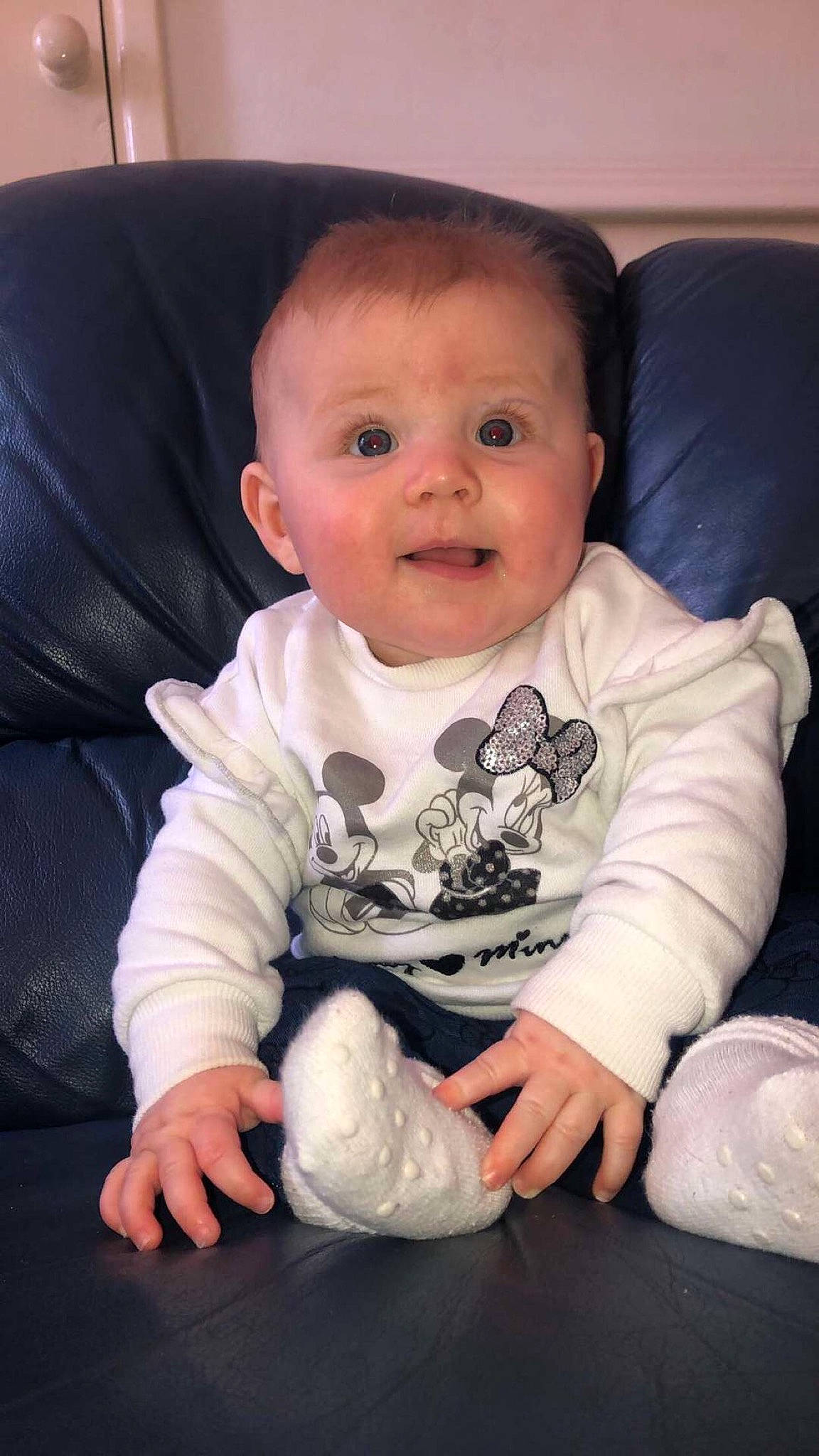 Ava-mae is registered to the contest to win money with this photo: arm, baby, cheek, child, face, finger, hand, head, leg, mouth, person, play, sitting, skin, smile, toddler, tummy_time