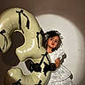 child, girl, balloon, number_three, white_dress, black_gloves, portrait, spotlight, party, celebration, indoor, face, costume, decor, event, cute, fashion, pose, young, expression