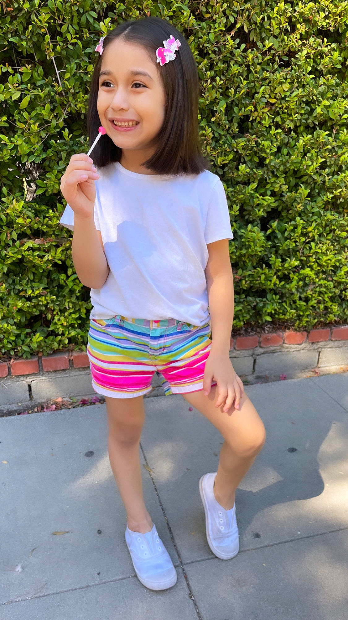 Dahlia is registered to the contest to win money with this photo: cool, electric_blue, face, grass, happy, human_leg, joy, knee, leisure, magenta, person, photograph, pink, shorts, sleeve, smile, summer, t_shirt, thigh, trunk