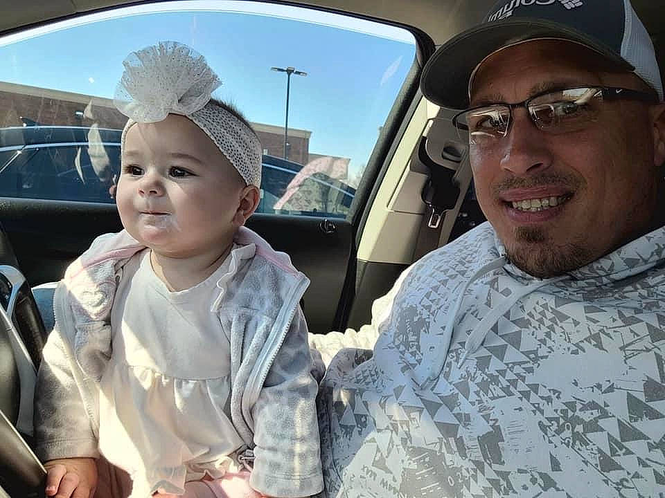 Tristan is registered to the contest to win money with this photo: army, baby, baseball_cap, cap, eyewear, face, fun, gesture, happy, hat, headgear, headwear, joy, military_person, military_uniform, person, skin, sky, smile, soldier