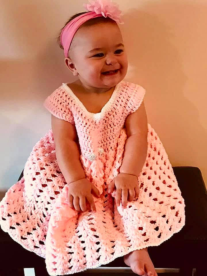Tristan joined the competition — help win amazing prizes! baby, baby_toddler_clothing, child, embellishment, face, fun, hair_accessory, happy, head, headgear, headpiece, joy, magenta, neck, pattern, person, pink, skin, sleeve, smile