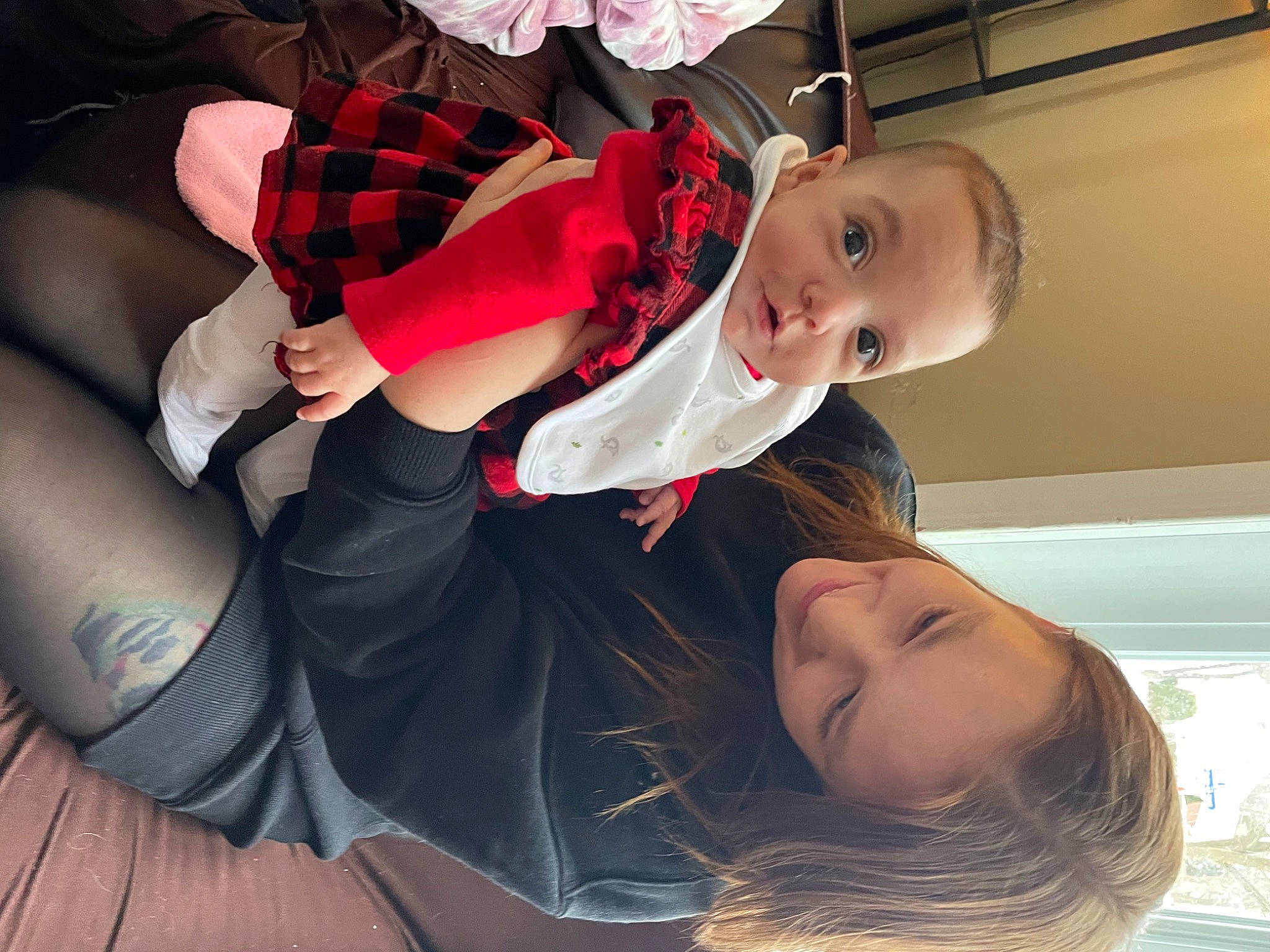 Flora is registered to the contest to win money with this photo: baby, baby_toddler_clothing, child, comfort, fun, gesture, hand, happy, head, human_body, human_leg, joint, joy, knee, lap, leg, mouth, person, snapshot, sock