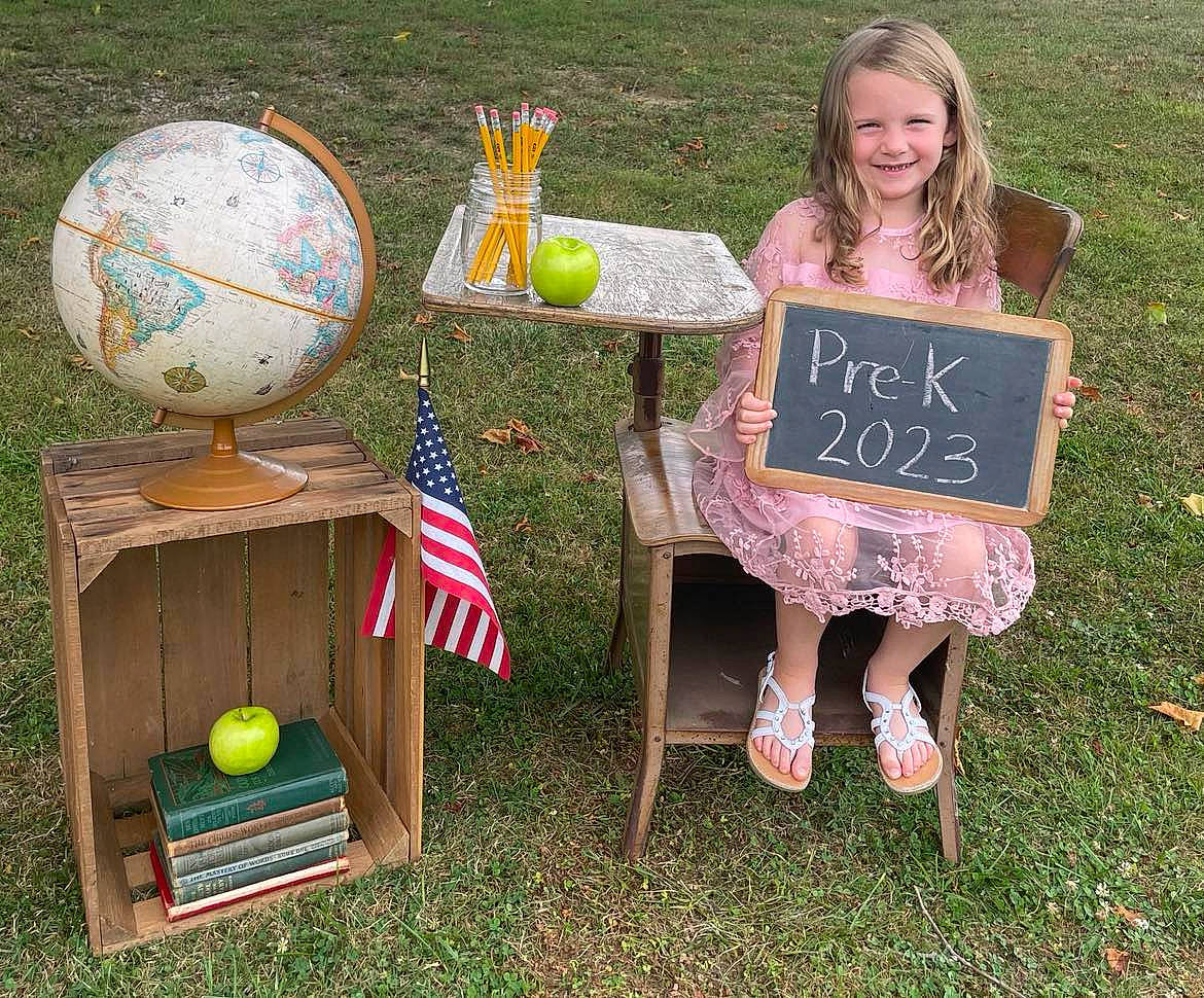 Athena joined the competition — help win amazing prizes! balloon, child, easter, event, flag, flag_of_the_united_states, fun, grass, handwriting, happy, joy, lawn, leisure, nature, party_supply, person, play, recreation, sitting, smile