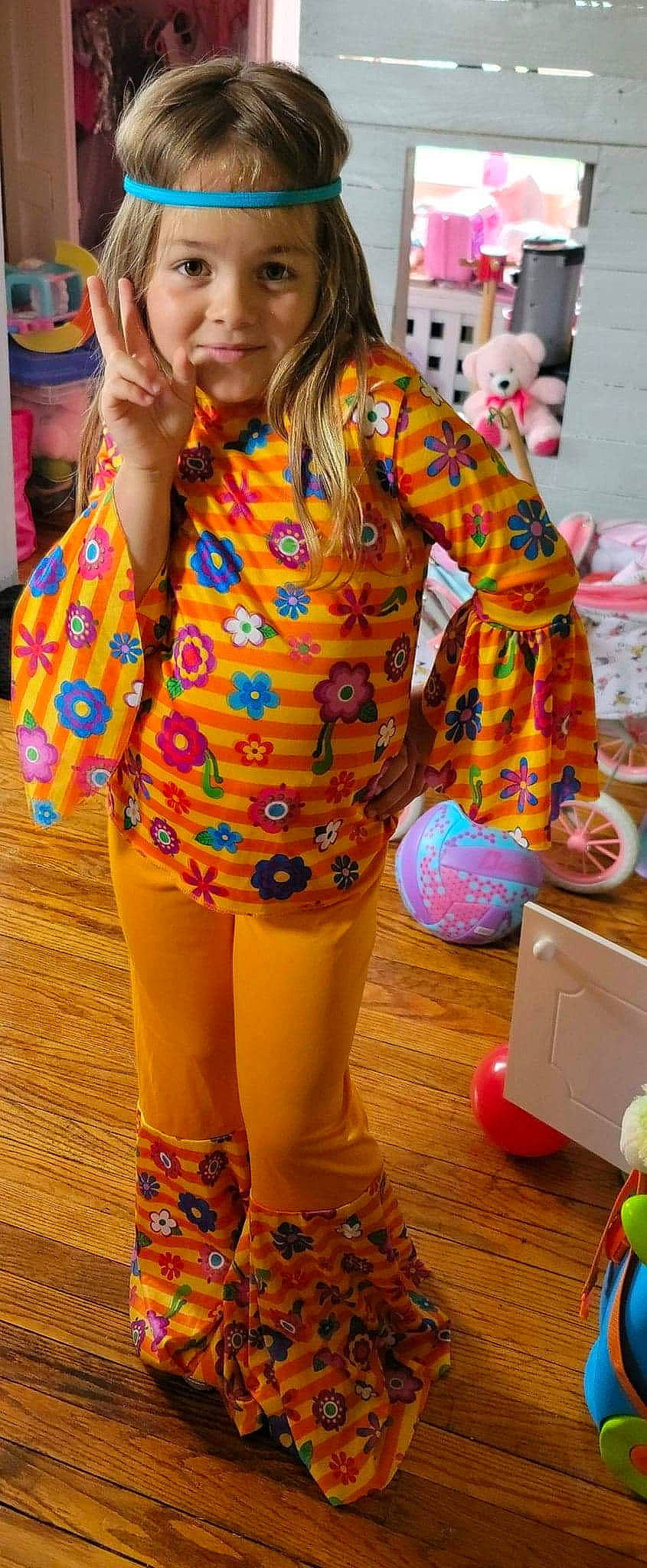 Ashtyn joined the competition — help win amazing prizes! bag, child, clothing, entertainment, event, fashion_design, flooring, fun, green, happy, human_leg, joy, leisure, orange, pattern, performing_arts, person, sleeve, standing, thigh