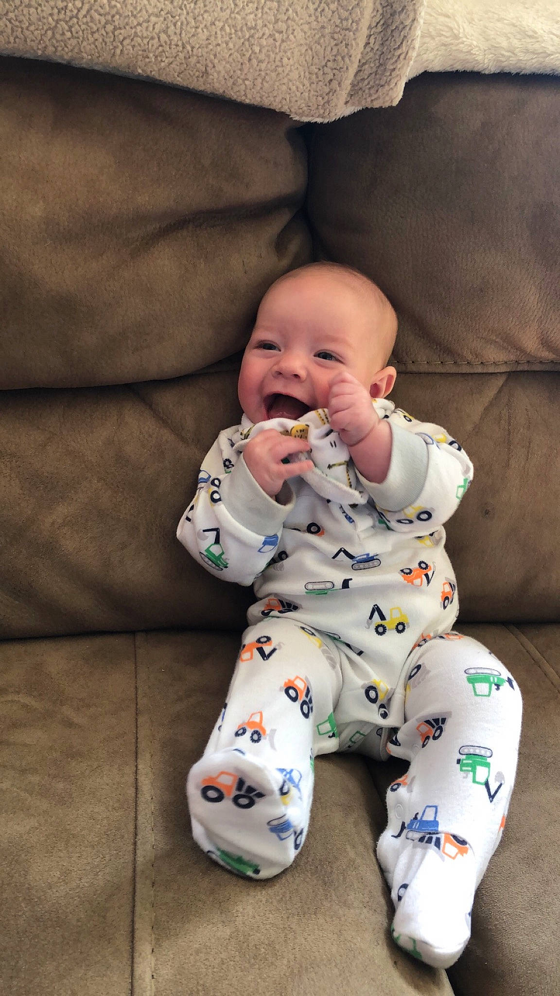 Maverick joined the competition — help win amazing prizes! arm, baby, baby_toddler_clothing, cheek, child, comfort, face, flooring, foot, happy, head, leg, linens, nose, pattern, person, sitting, skin, sleeve, smile