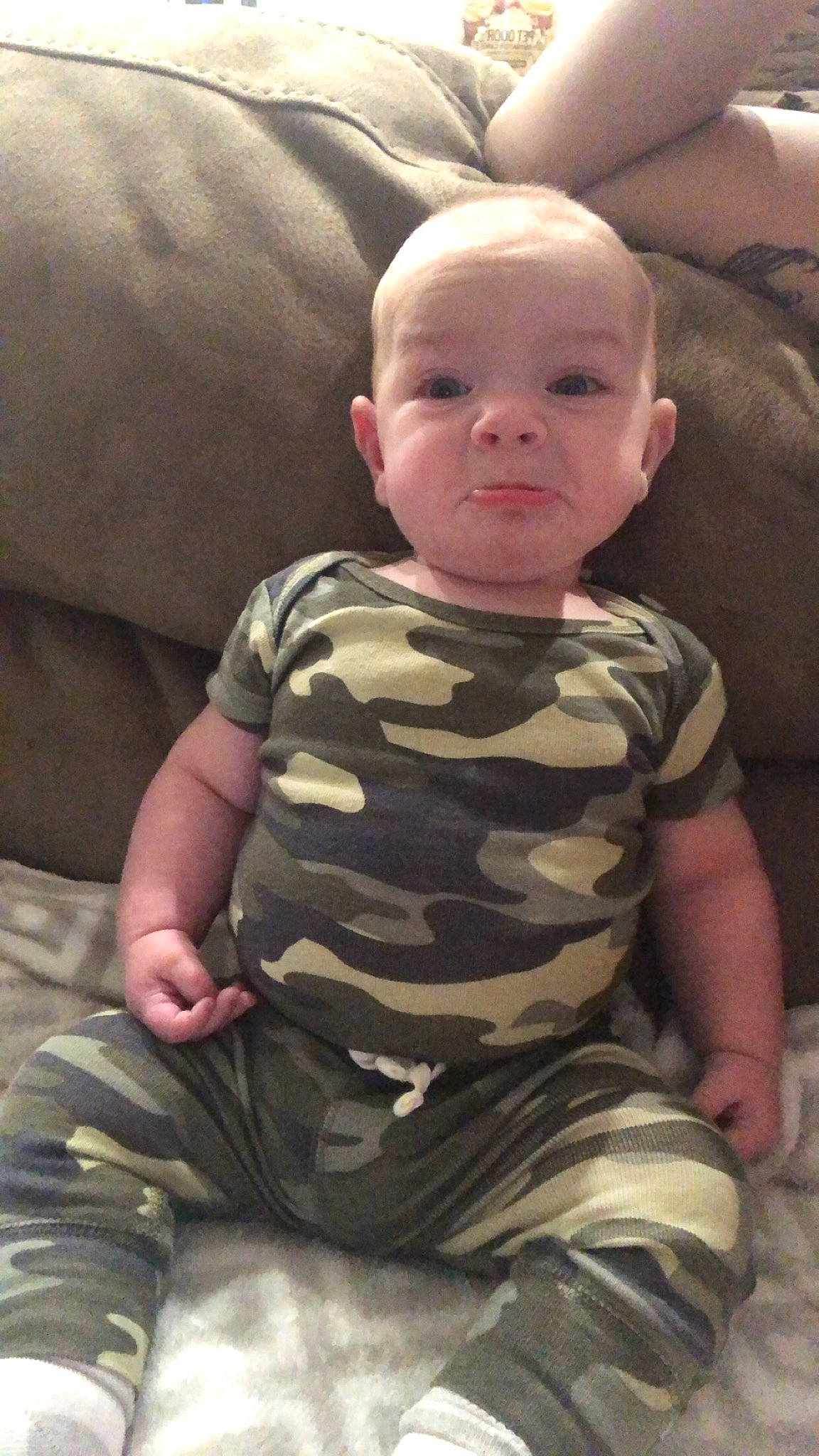 Maverick joined the competition — help win amazing prizes! arm, baby_toddler_clothing, camouflage, cheek, chin, comfort, eye, face, finger, head, human_body, joint, leg, military_camouflage, mouth, neck, nose, person, shoulder, skin